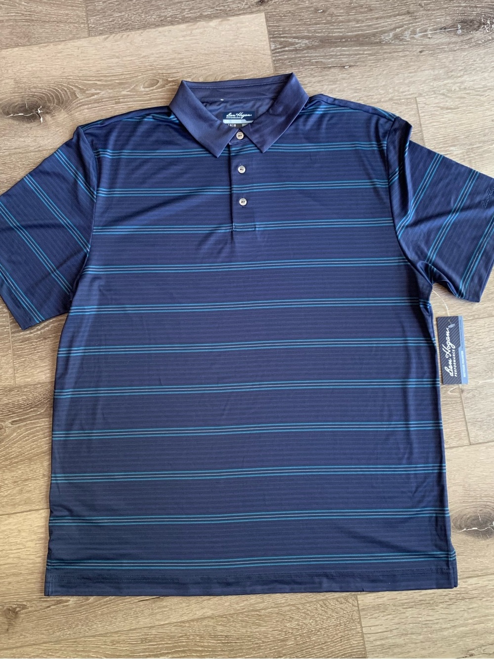 Ben Hogan Performance Navy Polo with Teal Stripe Detail in size L